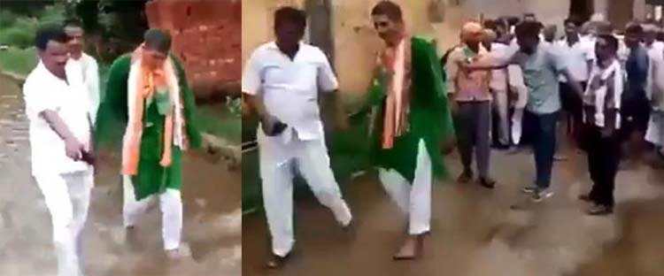 বিজেপির বিধায়ককে নোংরা পানিতে খালি পায়ে হাঁটিয়েছেন বিক্ষুব্ধ গ্রামবাসী