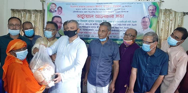 এম সাইফুর রহমানের বাড়িতে ৬শ পরিবারের মধ্যে খাদ্য সামগ্রী বিতরণ